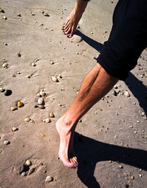 Barefoot running in the sand on a beach in Long Island